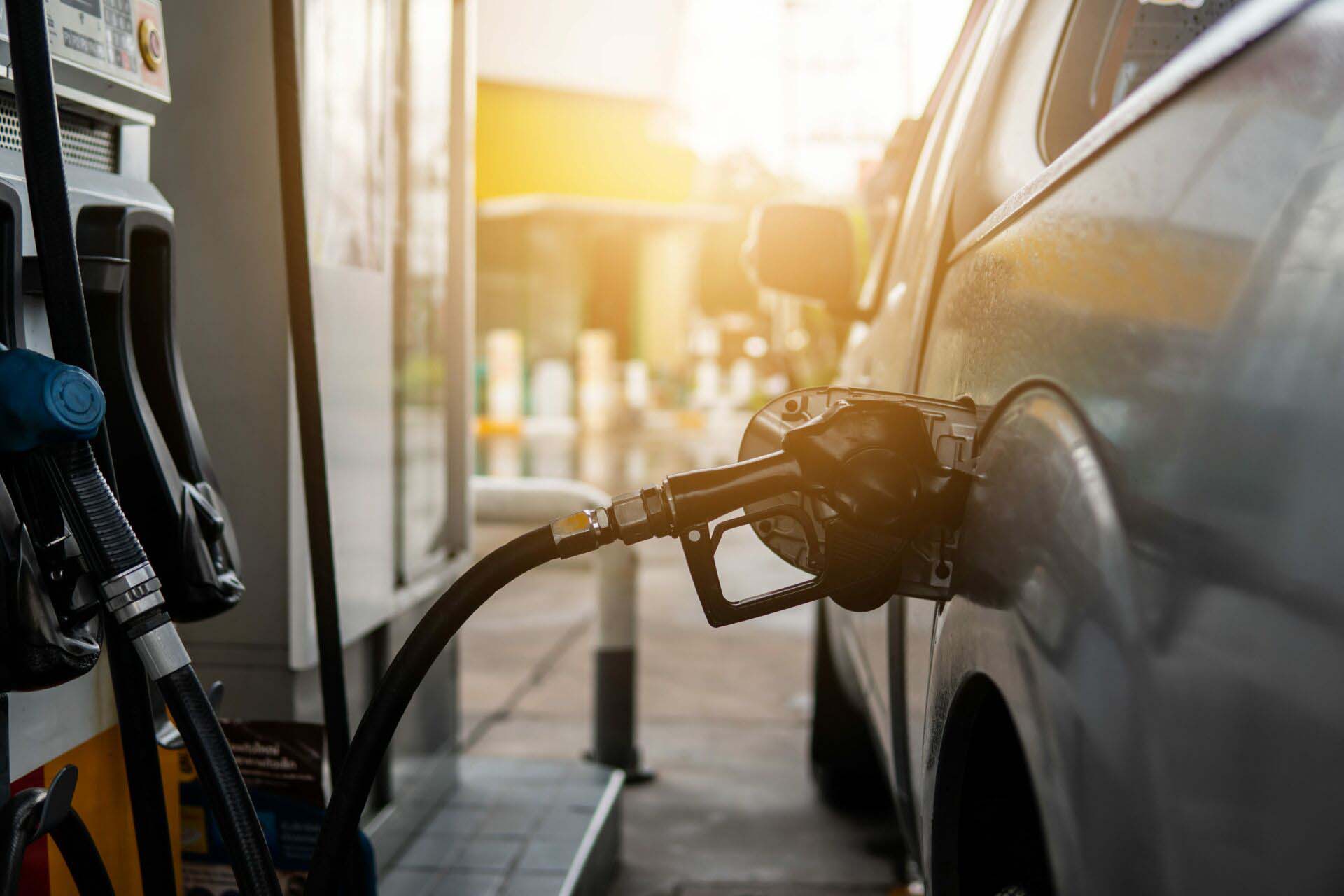 Fuel nozzle to refill fuel in car at gas station. Insurance for Gas Stations