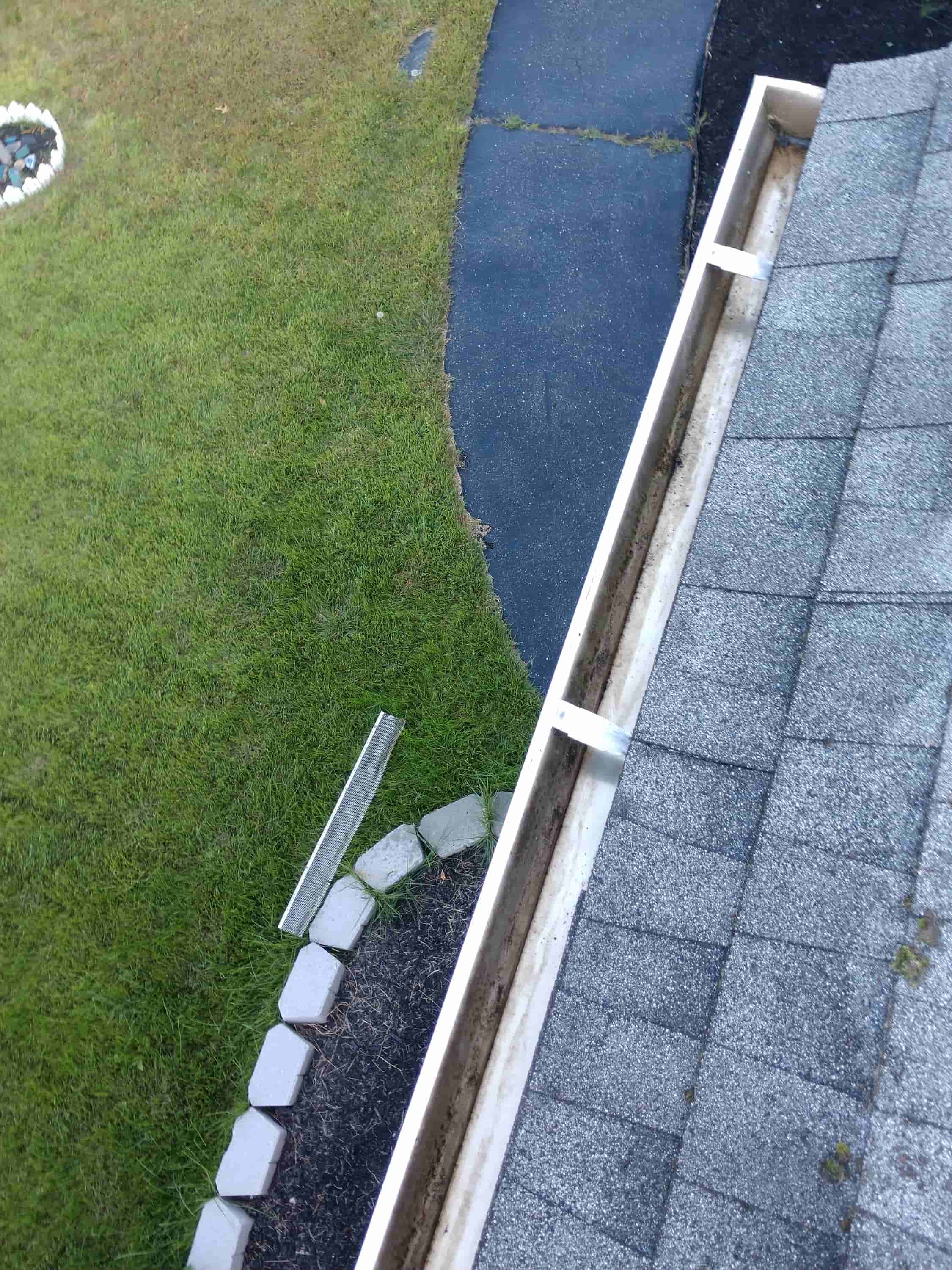 cleaning out gutter downspouts