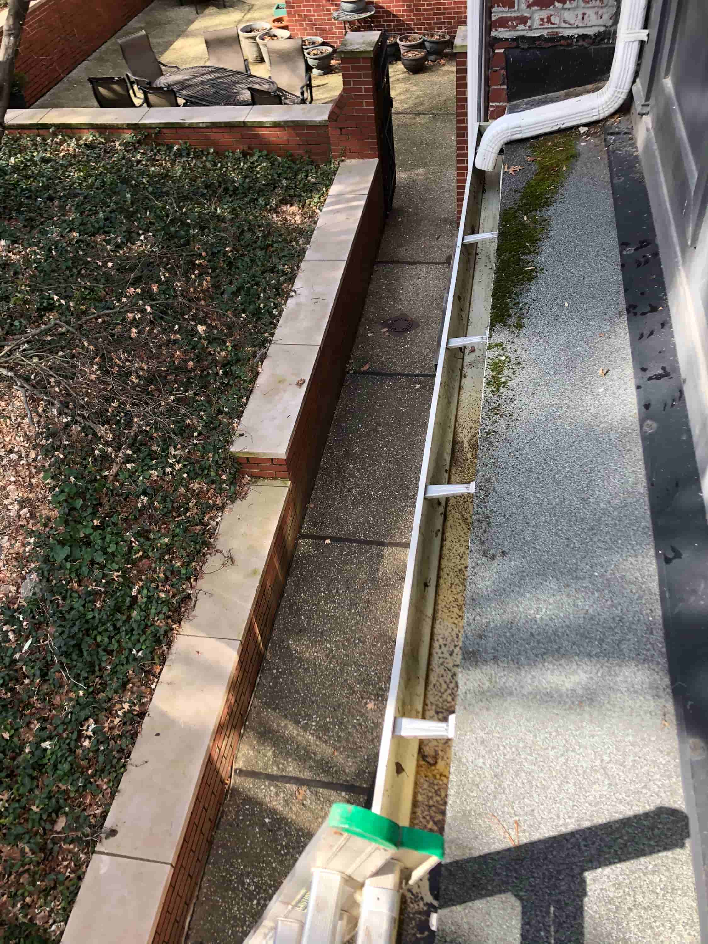 cleaning a gutter