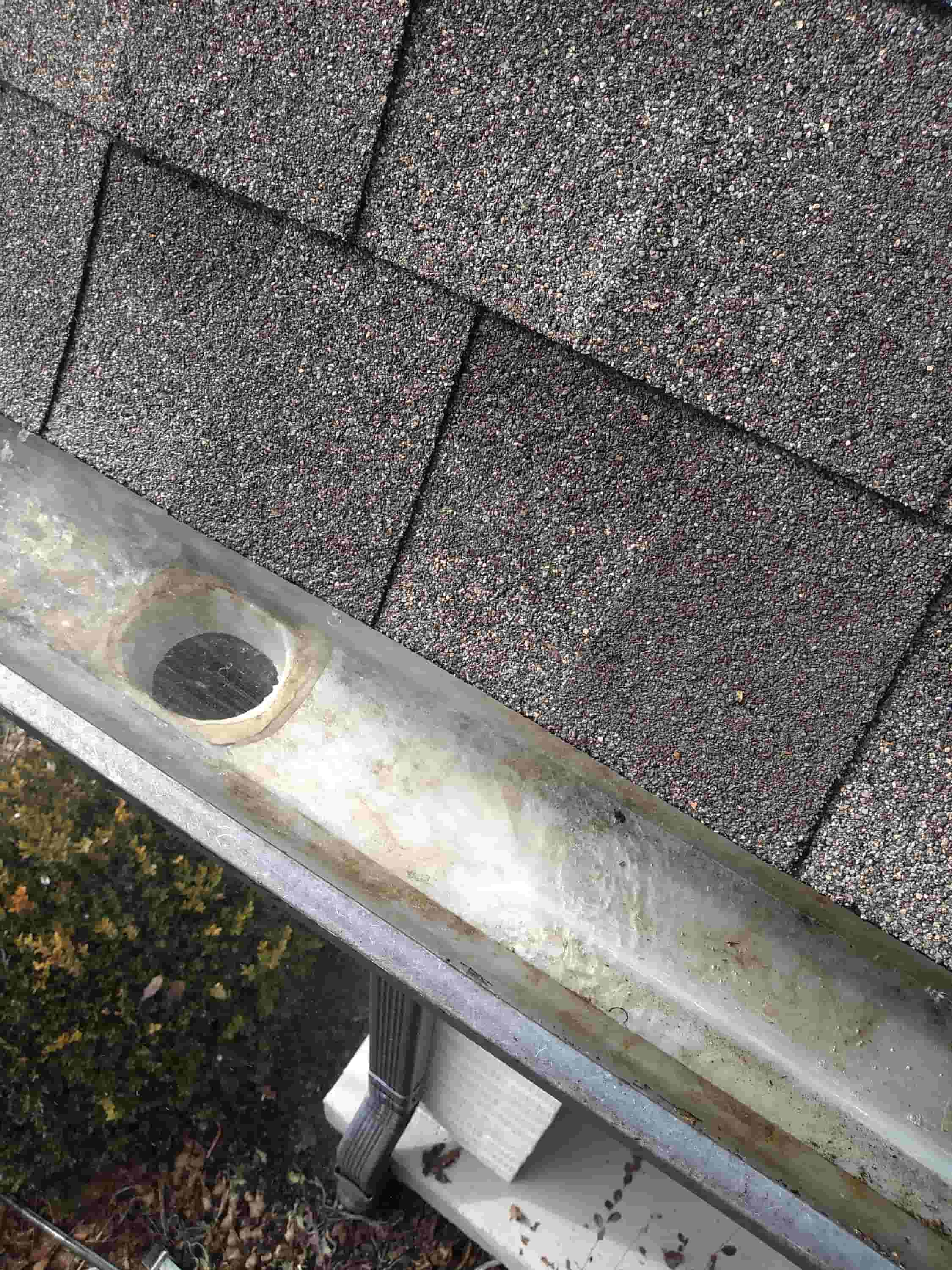 cleaning a gutter