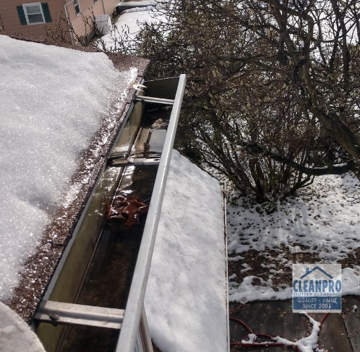 cleaning gutters by hand