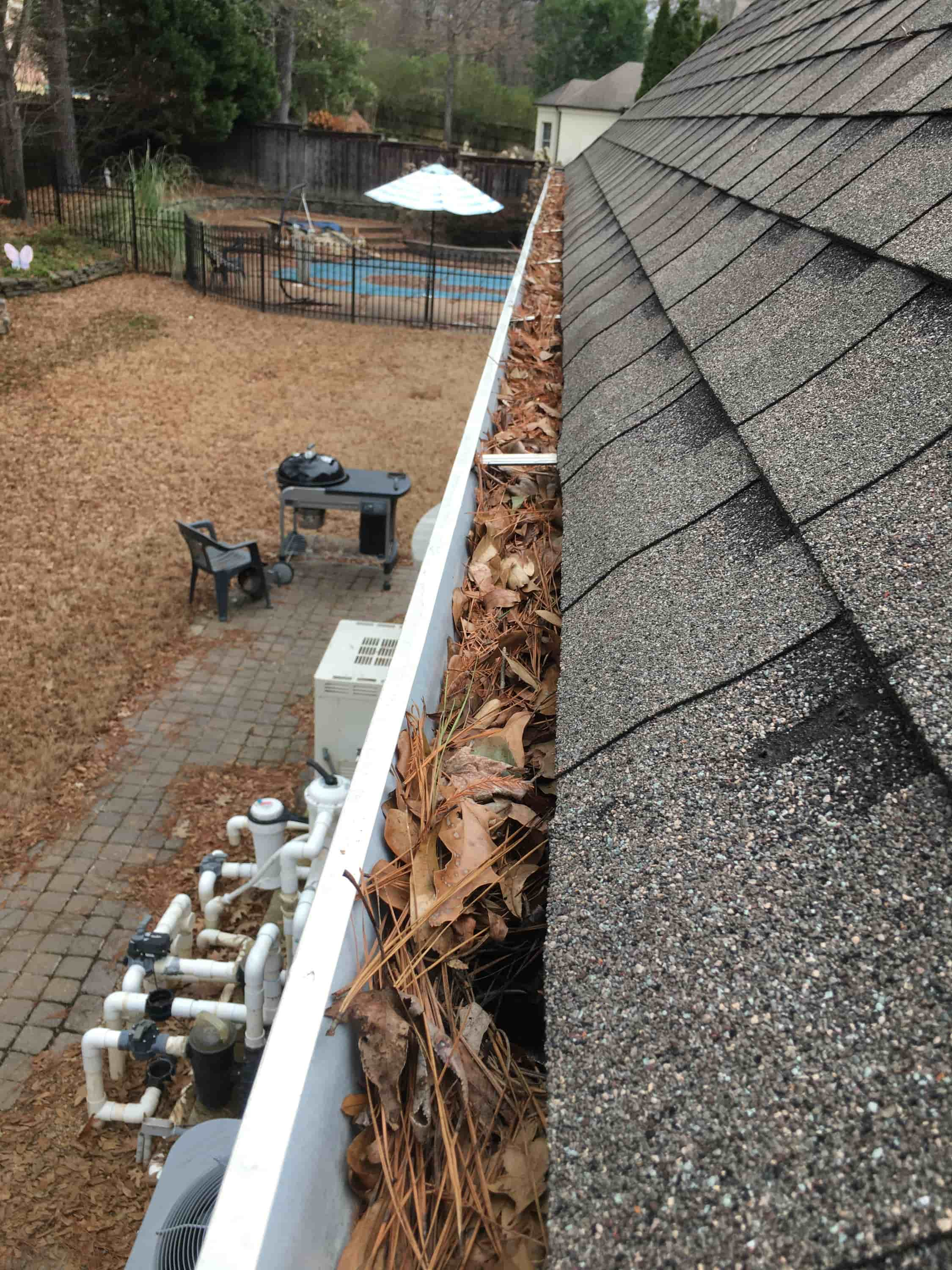 cleaning leaves from gutters