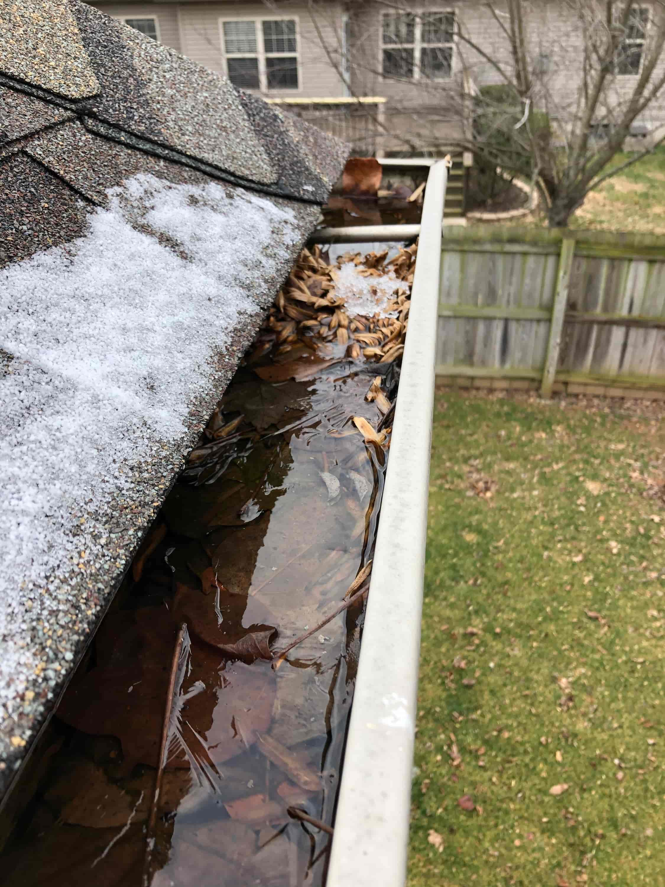 how to clean clogged gutters