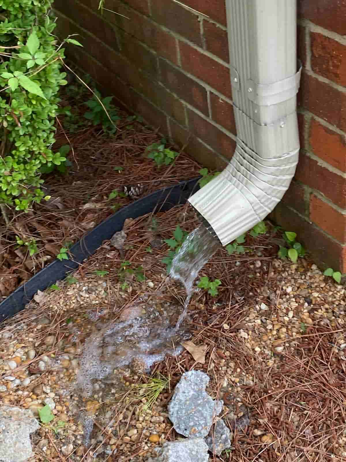 cleaning downspouts from ground