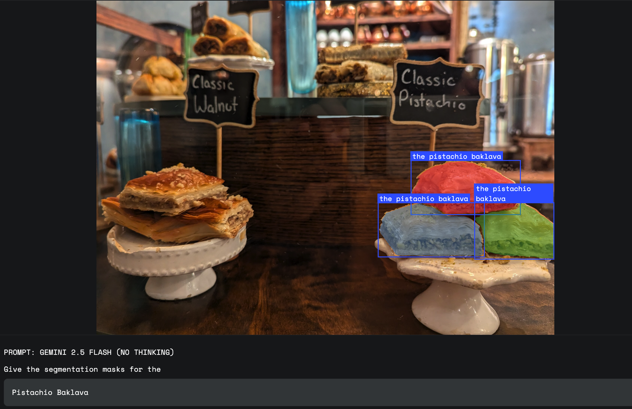 In a bakery setting, the model uses natural language segmentation to overlay masks on "the pistachio baklava" , distinguishing it from other nearby pastries based on in-image text.