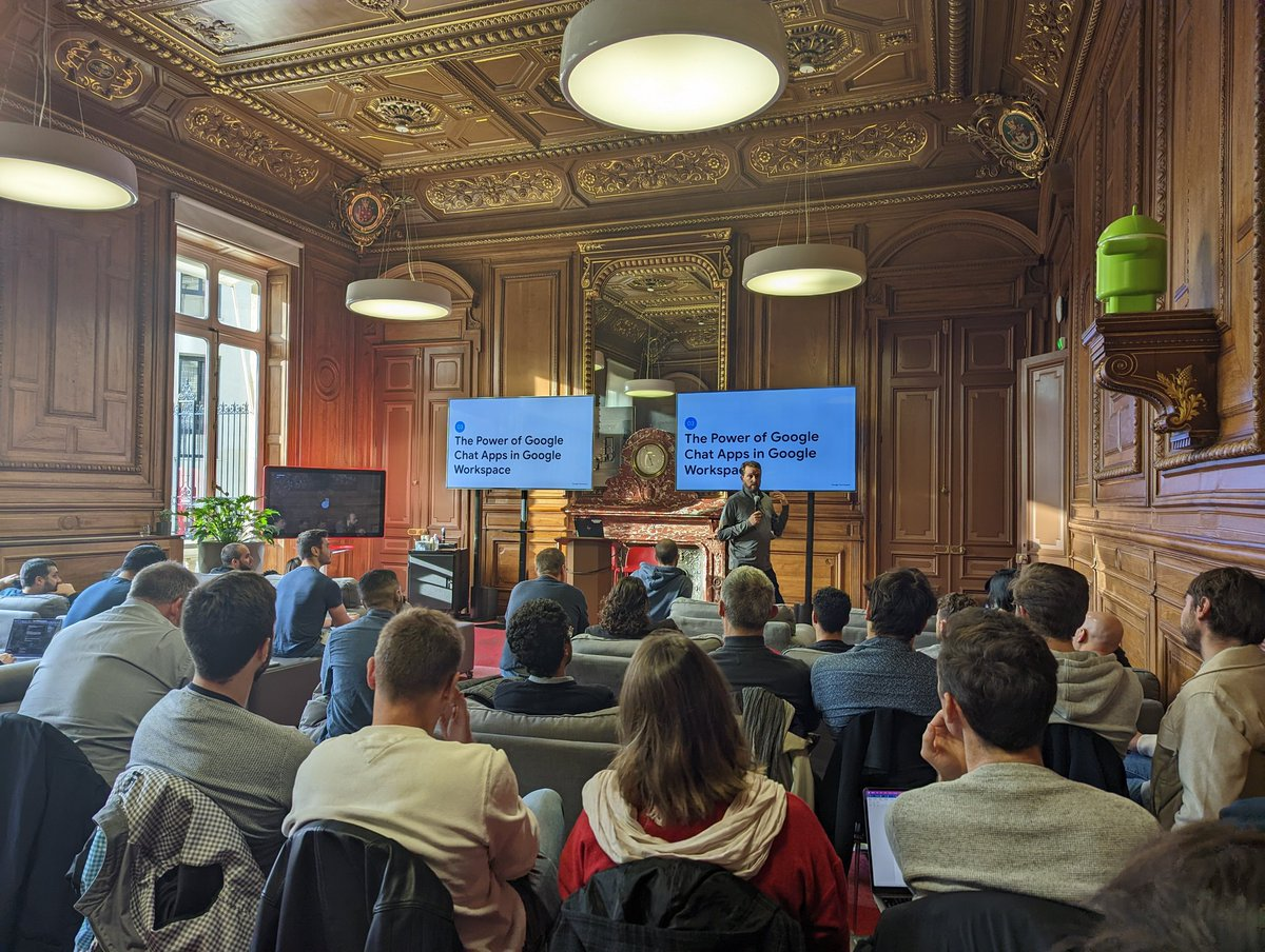 Photo of
      Developers listening to a presentation at Google Paris during Google Workplace Developer
      Summit