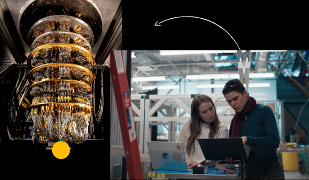 People looking at computer and a big machine