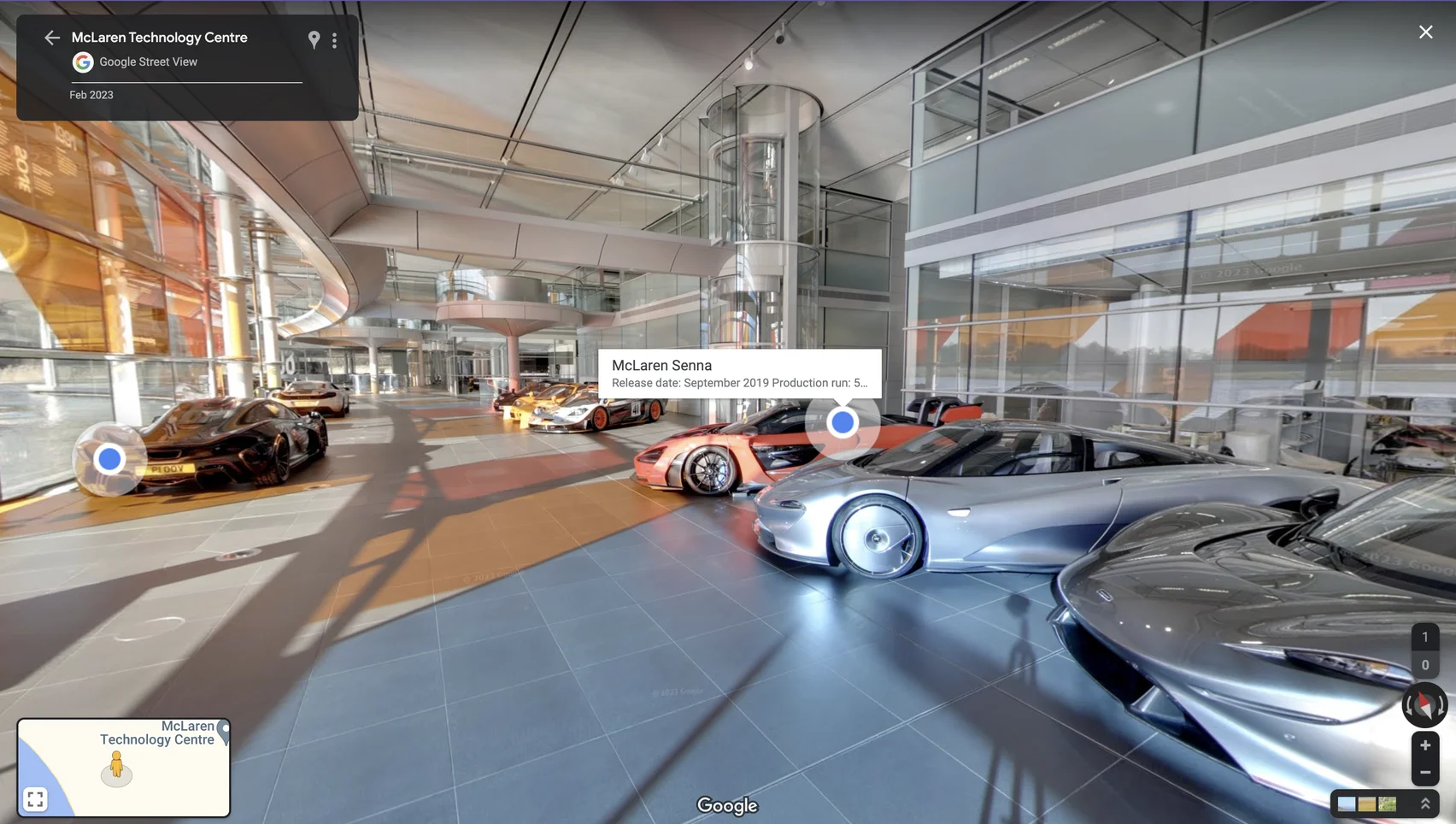 Street View imagery of the inside of the McLaren technology center shows several McLaren race cars.