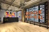 The reception desk in Google’s Montreal, Canada office. Behind the desk there is a colorful quilt by local artist Karen Desparois, and a large piece that spells out Google Montreal next to it.