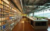 A view of the cafe in the Google office in Belo Horizonte, Brazil, with a wall of spice jars by the artist Máximo Soalheiro.