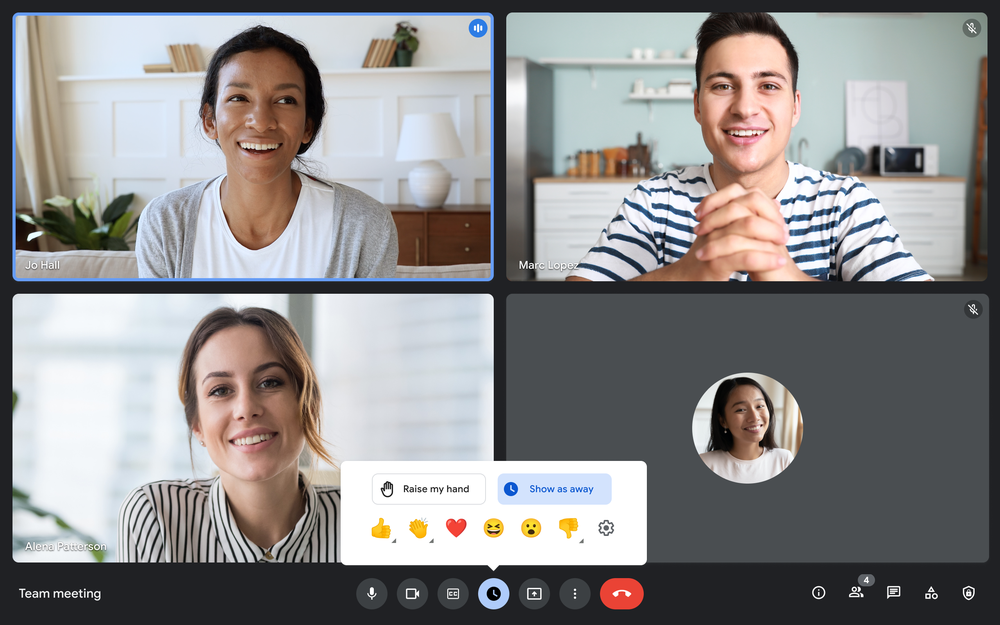 Screenshot of a Google Meet call with four callers’ tiled images on the screen. The bottom bar of the call shows the emoji option selected, with another bar pulled up showing the various emoji options — thumbs-up, clapping, heart, laughing, surprised, thumbs-down.