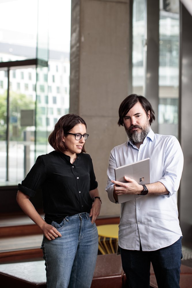 Photo of Professor Michael Bremner and Dr. Marika Kieferova at work at UTS looking at a laptop