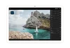 A photo is being edited with Adobe Lightroom on an Android tablet.