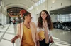 A person with a cochlear implant having a conversation while walking in a transit station (a complex listening  environment)