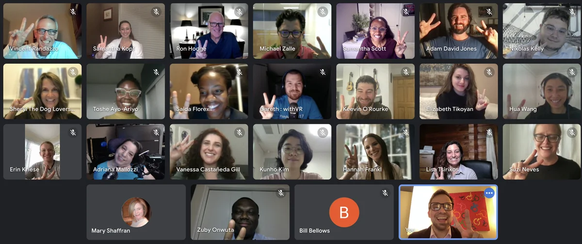 25 participants and mentors appear in a screenshot of the kickoff call for the 2Gether International tech accelerator, Each person tuning in is smiling and facing the camera while holding up two fingers as the peace sign.