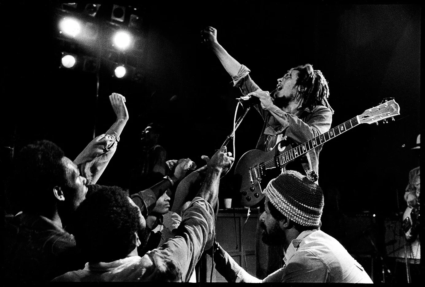 Bob Marley performing on stage in front of an audience