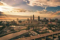 A picture of downtown Cleveland at sunset, with roads and skyscrapers