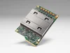 Obraz chipa Google Tensor Processing Unit (TPU). Za nim szare, gradientowe tło.