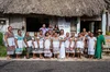 the community of Colectivo Loo’l Pich pose all together wearing traditional garments