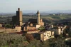 A view of Vinci, Tuscany, a small town with a church and a bell tower in the backgroun