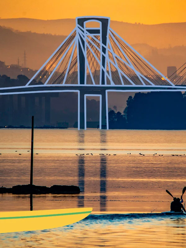 Image of an estuary with a bridge in the background. The silhouette of the bridge has been drawn on top of the photograph in blue.
