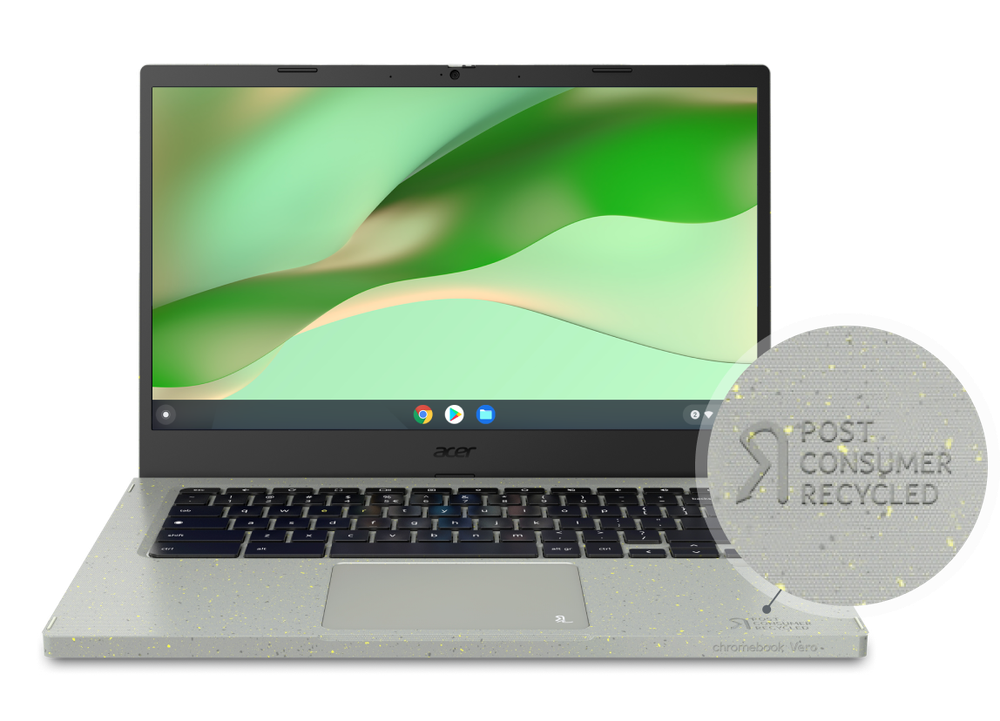 An Acer laptop with a green, wavy desktop background. A gray bubble zooms in on the laptop and shows the text “post consumer recycled.”