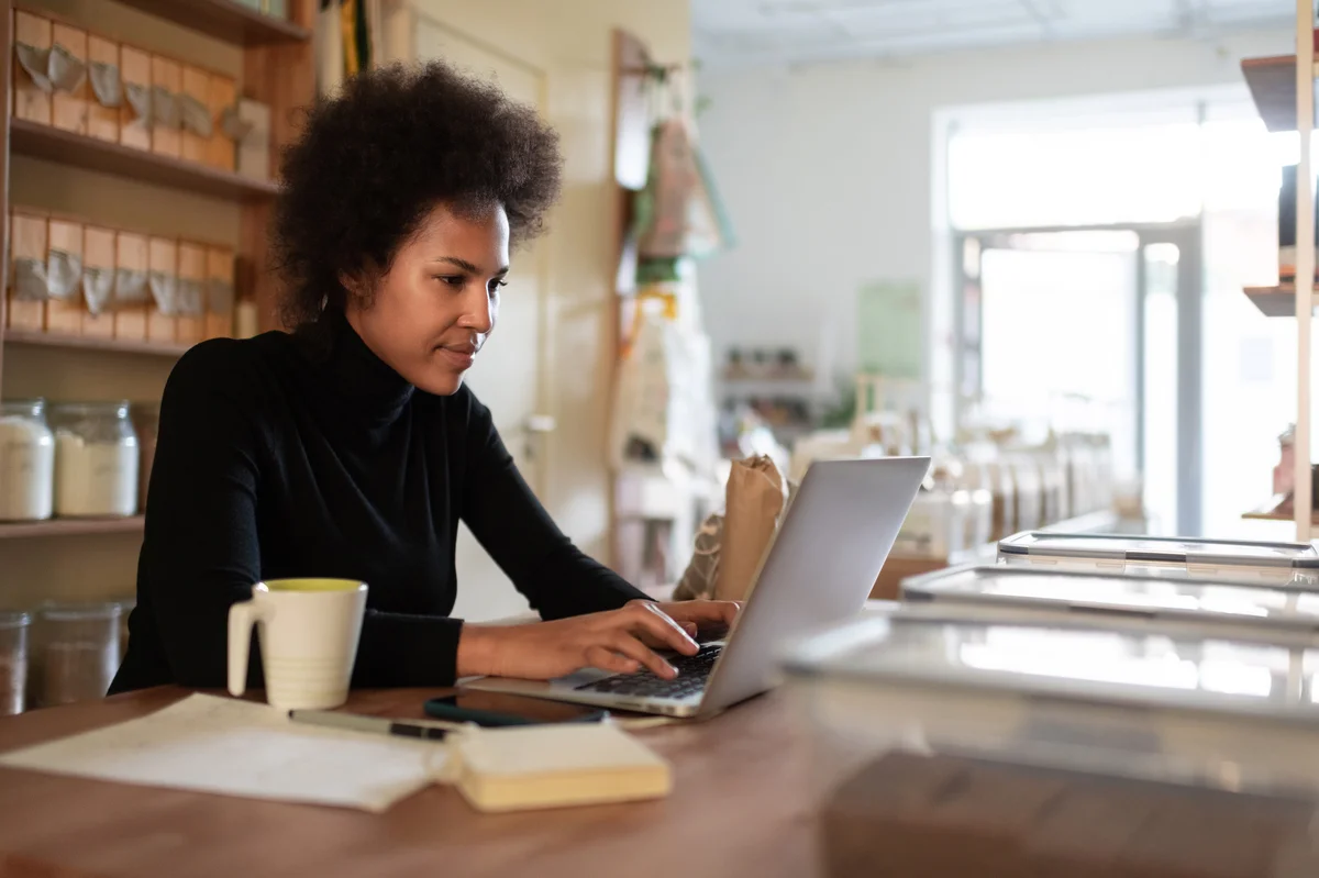 Woman typing on a computer