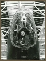 An engineer works in the bomb-aimer's position of a new Handley Page "Halifax" bomber