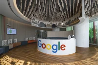 Round white front desk that reads "Google" in large letters.