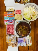 Various hot pot ingredients like noodles, fish balls, and tofu.