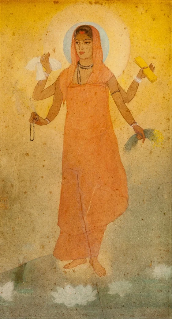 Faded illustration of a person with four arms holding a piece of jewelry, plants, a cloth, and papers, dressed in an orange robe and standing barefoot among white lotus flowers.