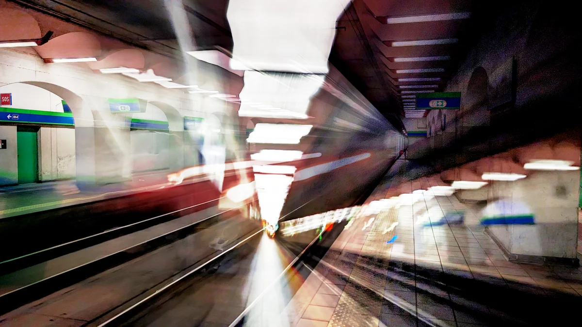 A blurry image of an underground metro station in Milan shot on Pixel using Long Exposure mode and then modified with Magic Editor.