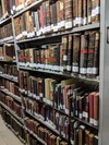 Tall bookcases at the National Library of Israel in Jerusalem filled with books.