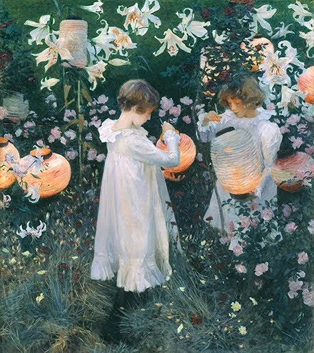 Two white-clad children in a garden lighting Chinese lanterns among the flowers on a twilit summer evening