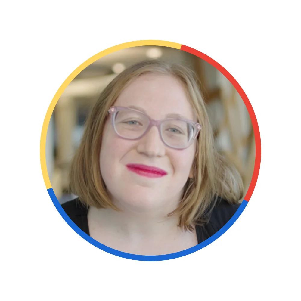 A headshot of a female educator from Chicago wearing glasses and short brown hair.