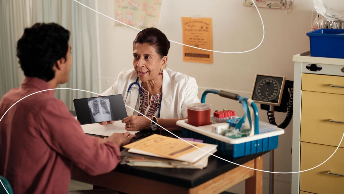 Image of a doctor and a patient reviewing a scan.