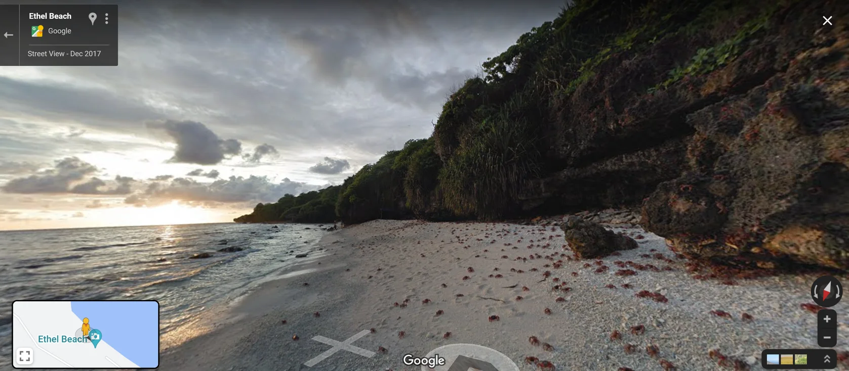 Street View imagery of crabs migrating on the shore of Ethel Beach on Christmas Island, with a beautiful sunrise view of the water