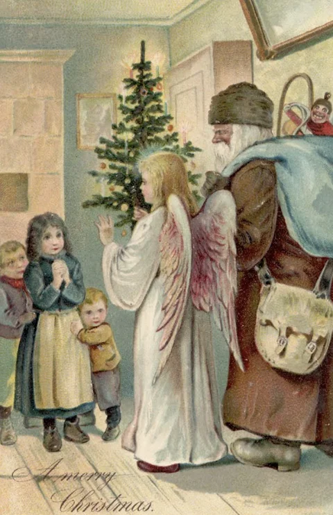 Image of Santa and angel at Christmas tree