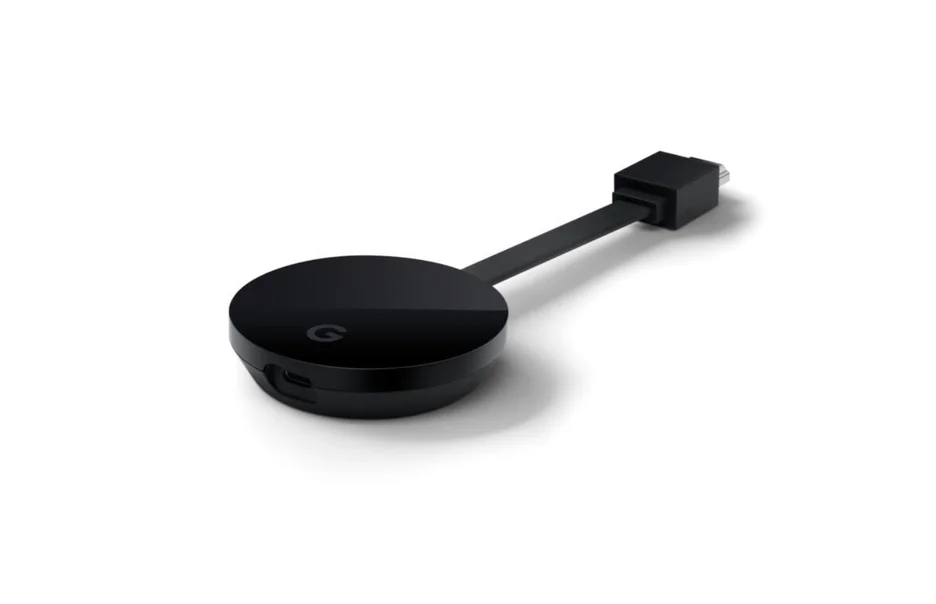 A black, puck-shaped device with an ethernet port and a Google G logo with a black, flat HDMI cord attached