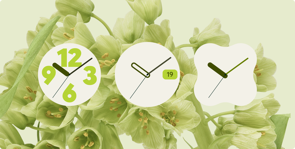 Light green photo of flowers as Android wallpaper. The analog clock selection in the foreground shows three different types of analog clock faces.