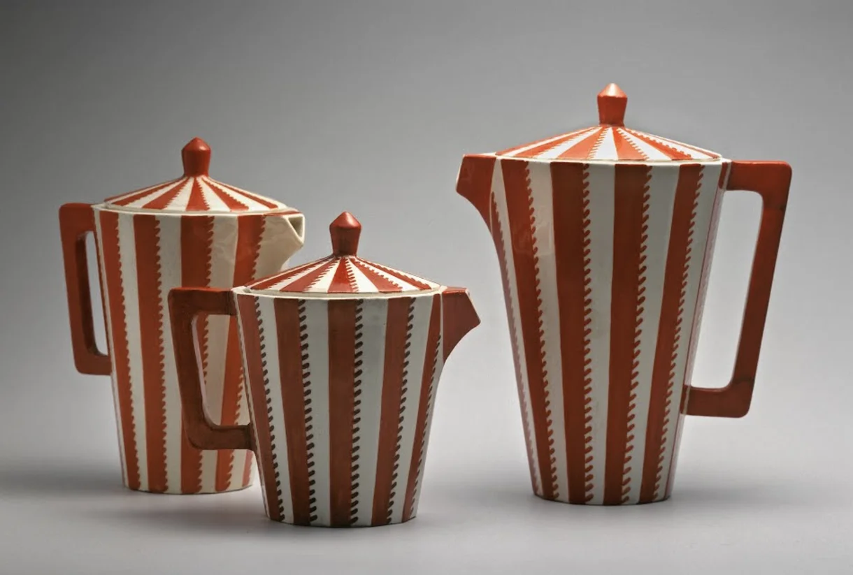 Red- and white-striped coffee pots made in Cubist style with angular handles