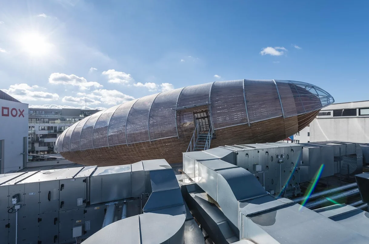 A huge structure resembling an airship built over the roof of the DOX Center for Contemporary Art