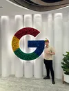 Quan posing with Google "Super G" logo