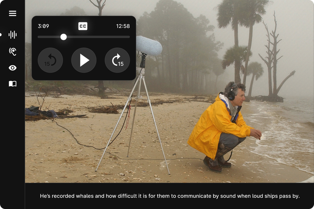 A screenshot from online stoytelling experience Auditorial shows an image of Bernie Krause kneeling down beside the ocean, recording the waves. Closed captions at the bottom of the screen read 'He's recorded whales and how difficult it is for them to communicate when loud ships pass by'.