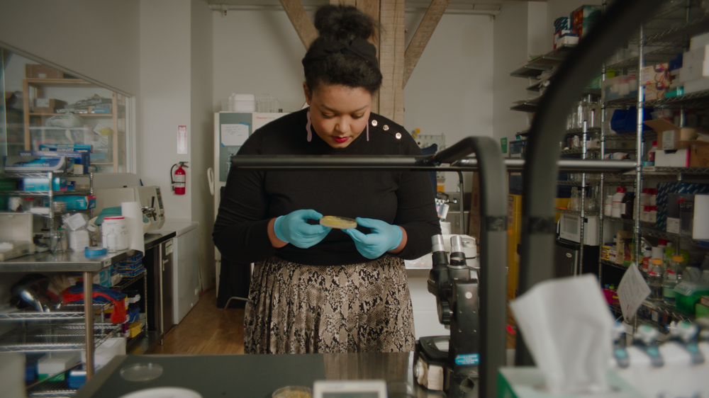 A photo of Ashley Jane Lewis in a lab