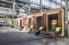 Workers are manufacturing a modular home.