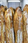 A stack of freshly baked baguettes