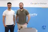 From L-R the male founders of Ethiack Jorge Monteiro and André Baptista behind a podium with the Google for Startups signage in the background