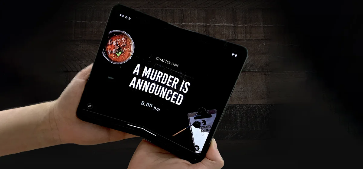 An image of two hands holding a Google Pixel Fold, opened up to reveal an eBook opened up on a screen saying 'Chapter One: A murder is announced. 6pm.'