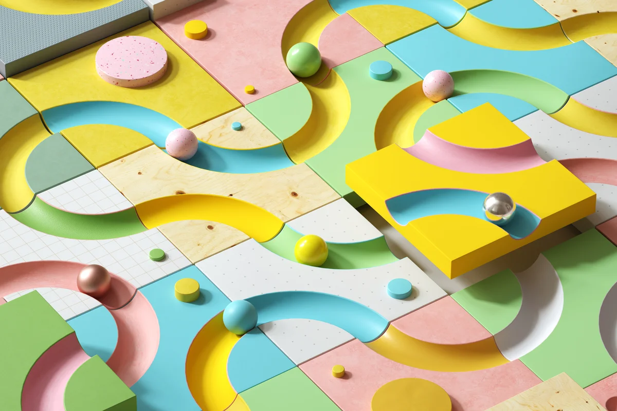 Image of multi-colored blocks with oval concave, forming a pattern of a curved road.